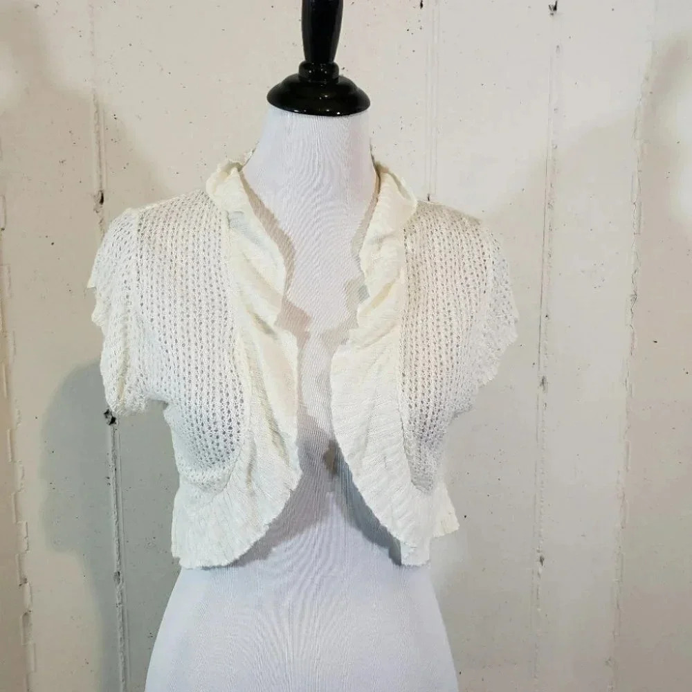 Say what XL juniors‎ cream ruffle shrug